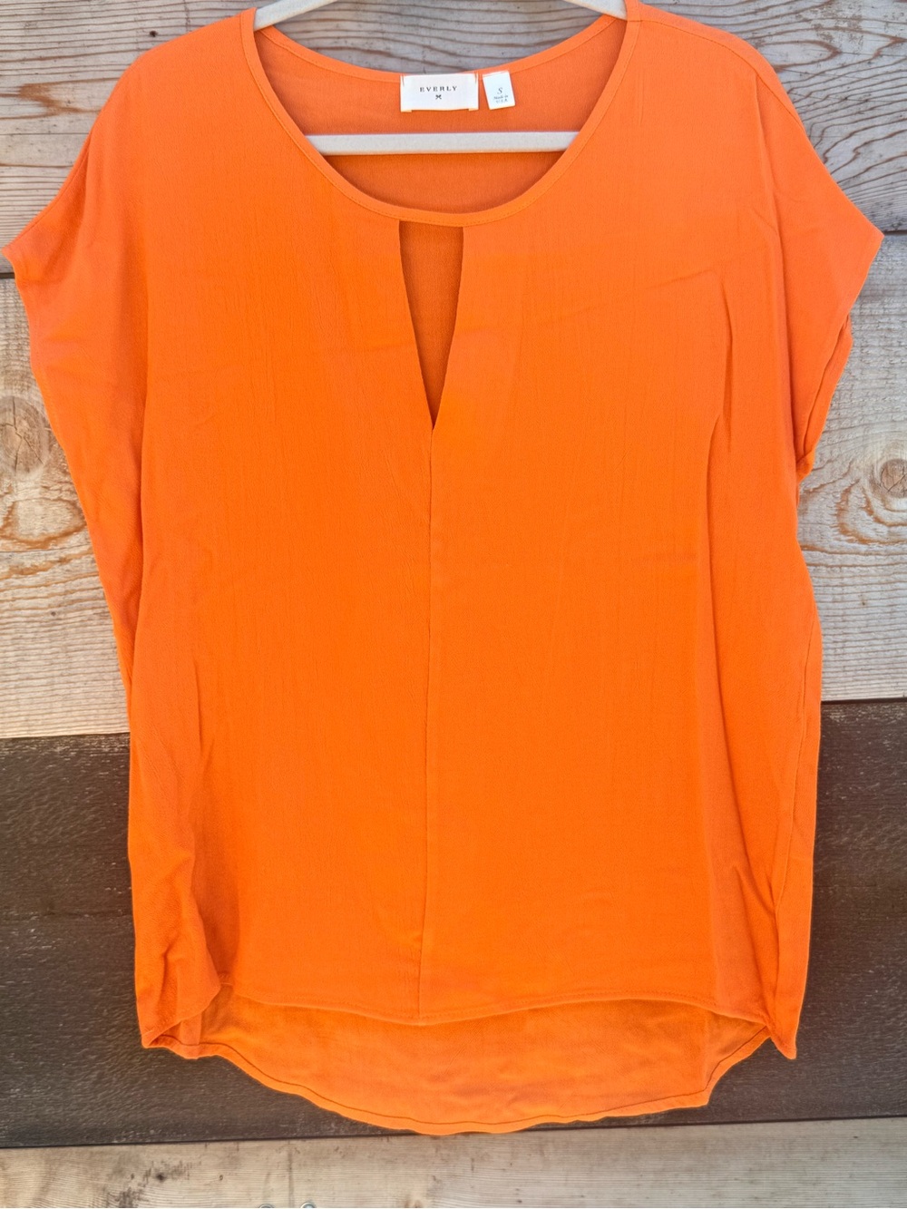 IYKYK… Team Spirit 🧡 Bright Orange Split-Front Short Sleeve Tunic - Picture 1 of 2